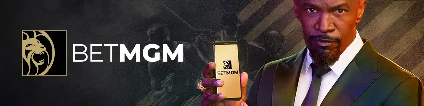 BetMGM advertisement with Jamie Foxx holding a smartphone displaying the BetMGM app. The BetMGM logo is also shown